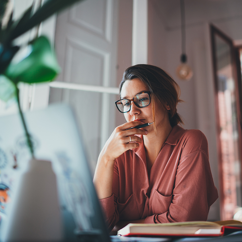 Young businesswoman thinking about something while sitting front